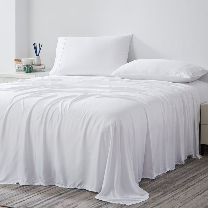 Angled view of 500-thread-count Tencel Lyocell extra deep pocket sheet set in white showing fitted sheet with 21-inch pocket