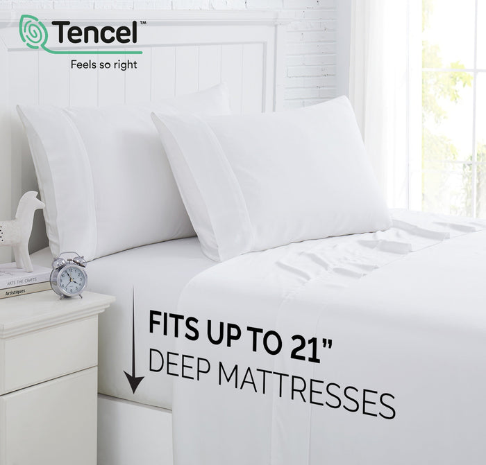Angled view of 500 thread count Tencel Lyocell sheet set showcasing 21-inch extra-deep pocket on a staged white bed