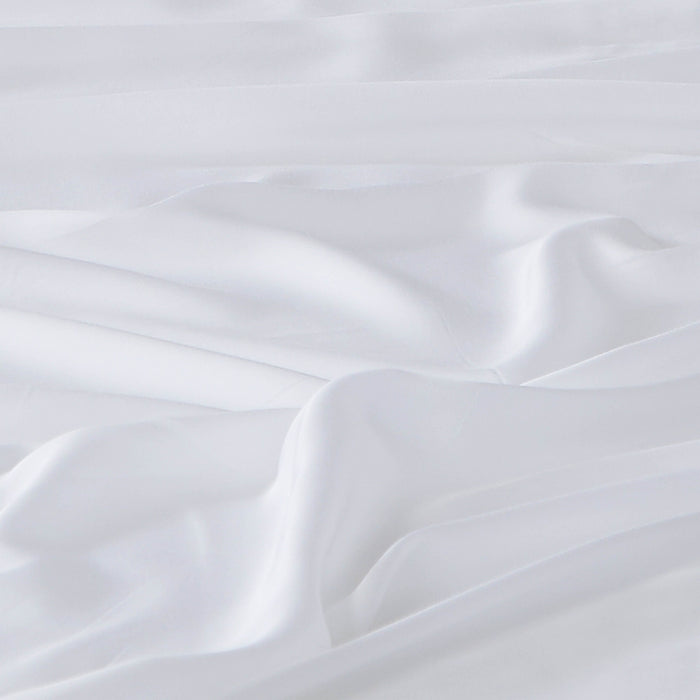 Close-up of 500 thread count Tencel Lyocell sheet showing smooth sateen weave and drape in white