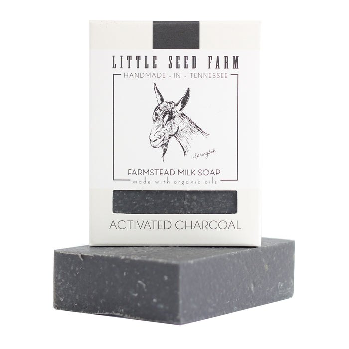 Little Seed Farm’s Activated Charcoal Facial & Body Bar, handmade in Tennessee with organic oils, is perfect for acne-prone skin and detoxifying care. Features goat-themed packaging and a sleek dark gray finish.