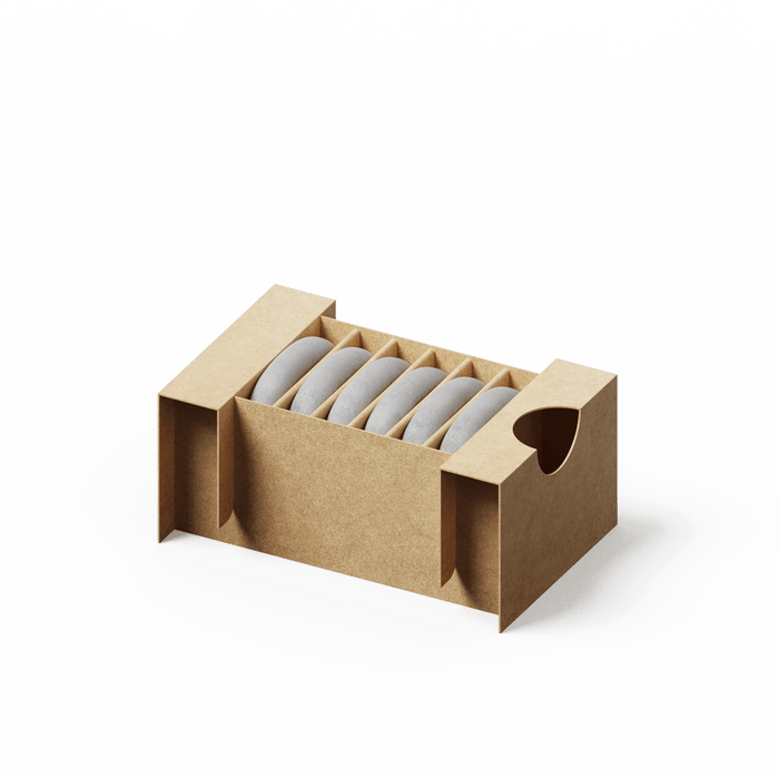 Aroma Stone 6-Pack featuring six cylindrical ceramic diffuser stones neatly arranged in a kraft paper storage box with protective dividers and side handles for easy transport
