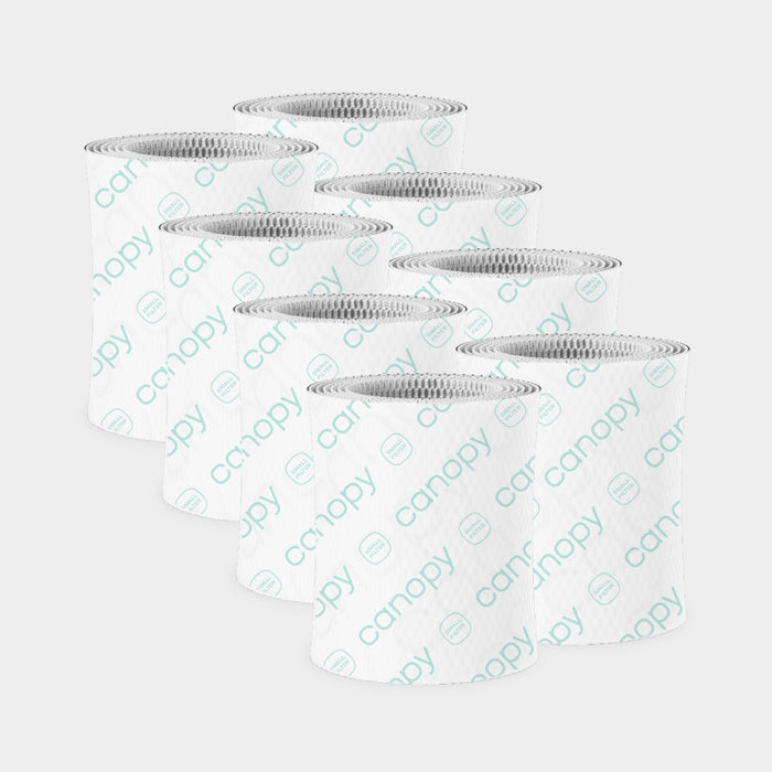 Bedside Humidifier Filter 2.0 Bundle featuring eight cylindrical blue paper-based filters with textured honeycomb pattern and white trim, arranged in two rows showing their antimicrobial design for optimal air purification
