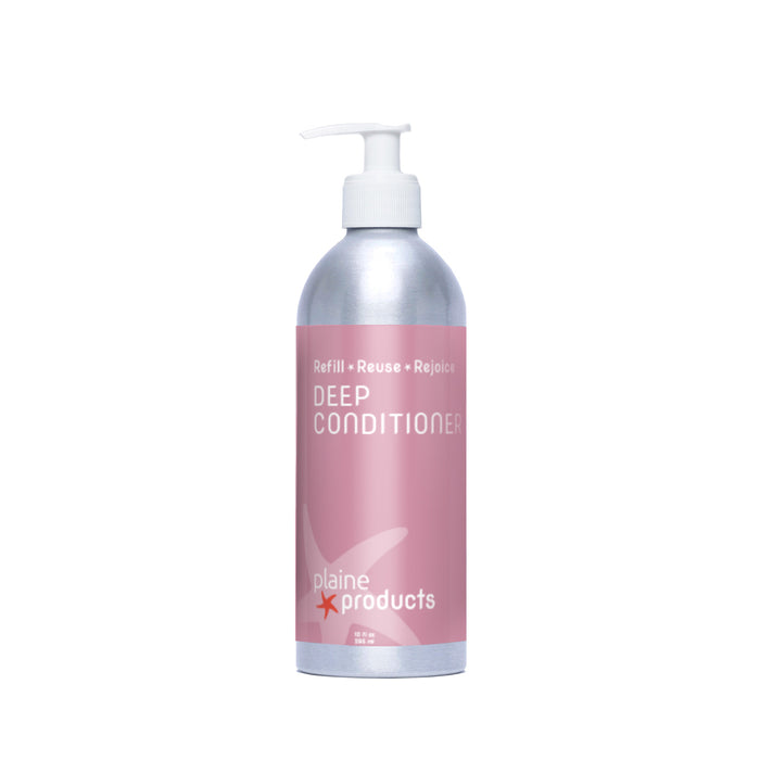 A silver pump bottle of Plaine Products Deep Conditioner features a pink label with "Refill • Reuse • Rejoice" and a starfish graphic. This hair moisturizer restores shine and is shown against a white background.