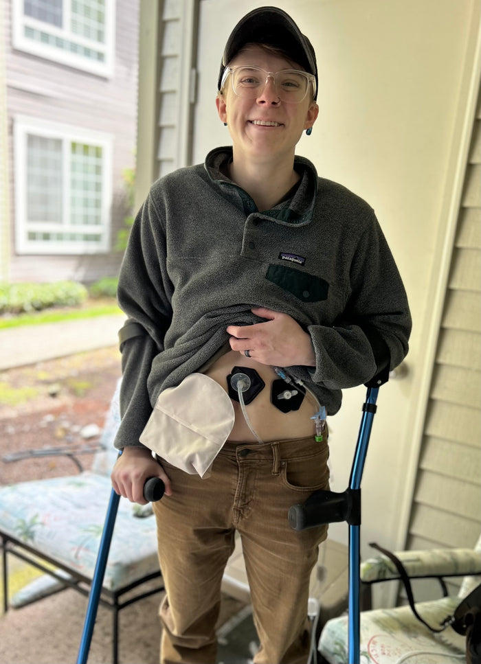 Man wearing multiple black g-tube pads
