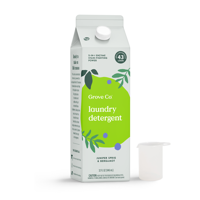 A Grove Co. Laundry Detergent – 5-in-1 Enzyme Stain Fighting Power in Juniper Sprig & Bergamot scent features a fresh design with a green label. Comes with a clear measuring cup and provides 43 loads of trusted cleaning.