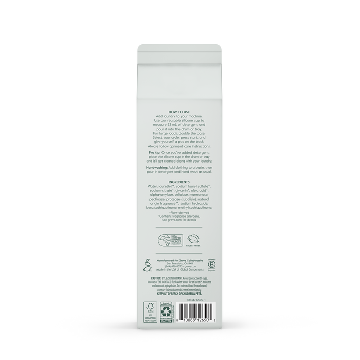 Back view of Grove Co. Laundry Detergent – 5-in-1 Enzyme Stain Fighting Power in a white bottle, showing gray text with enzyme formula details, instructions, ingredients, recycling symbols, and barcode on a smooth white background.