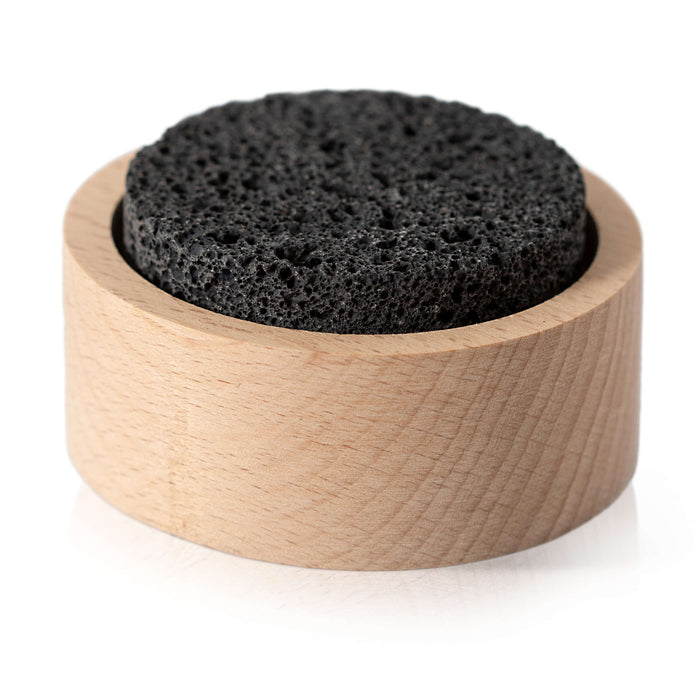 A Plant Therapy Lava Rock Passive Diffuser, featuring a round black lava rock set in a light wooden holder, is displayed on a white background.