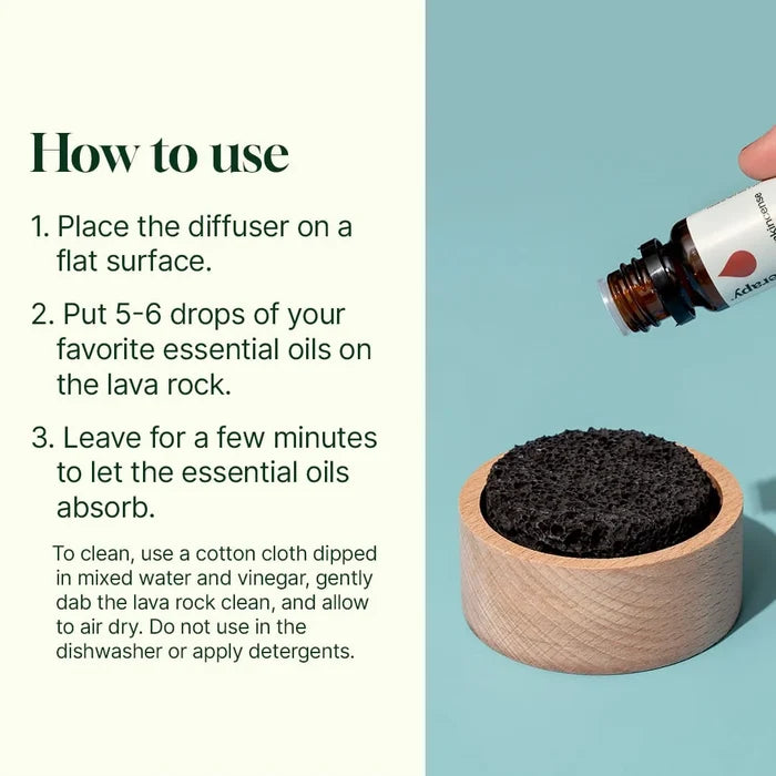 A hand holds a Plant Therapy Lava Rock Passive Diffuser essential oil bottle above the round black diffuser, which sits in a wooden holder, while usage and cleaning instructions appear on the left.