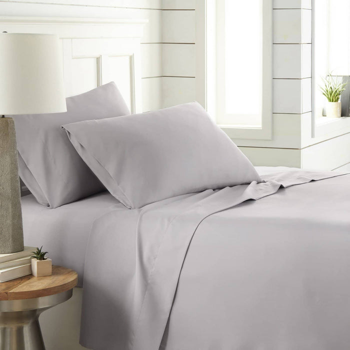 Angled view of Southshore Essentials 4-Piece Sheet Set in light grey showing smooth, wrinkle-resistant fabric on a bed