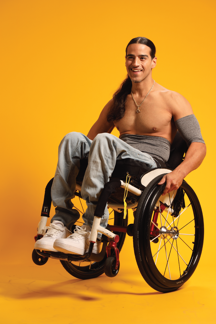 Man in wheelchair wearing Steel stretch waistband and support sleeve