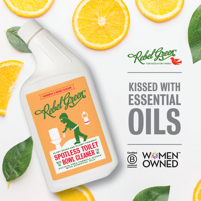 Rebel Green Toilet Bowl Cleaner sits among orange slices and green leaves. "Kissed with Essential Oils" text appears, plus Certified B Corporation and Women Owned logos, highlighting its eco-friendly commitment.
